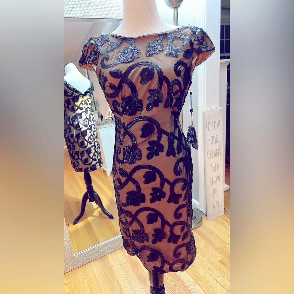 Elegant formal dress to knee. Black sequent with mesh and nude/tan lining.